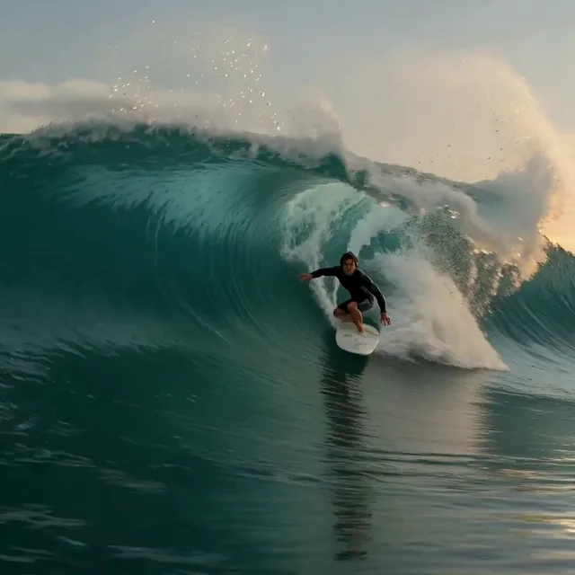 AI video generator example of a surfer riding a large ocean wave